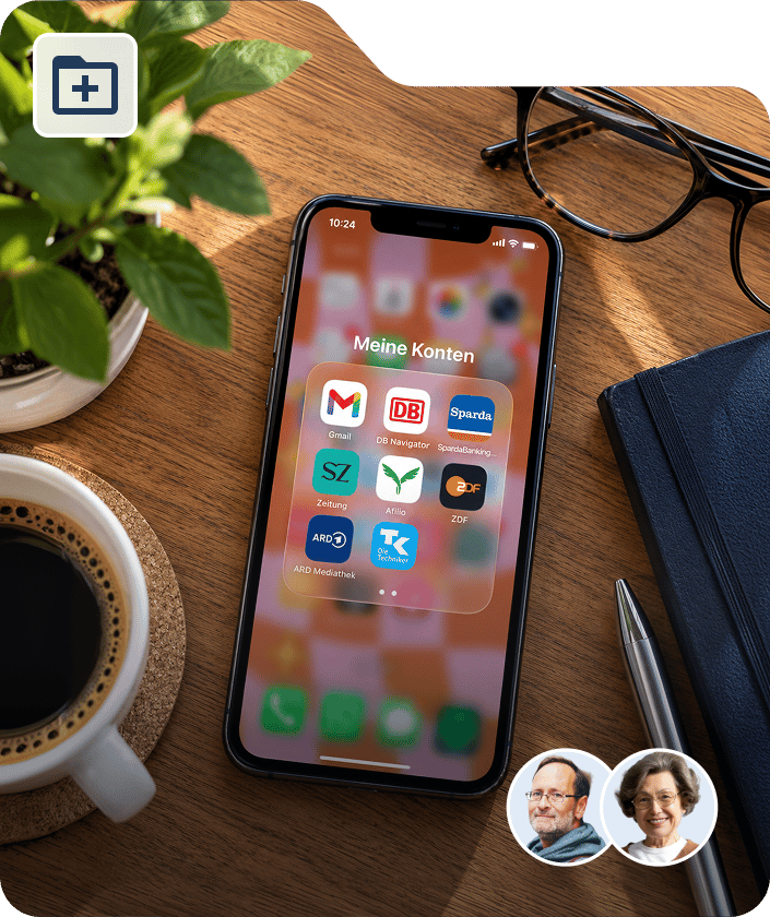 Ein Smartphone mit geöffnetem App-Ordner liegt auf einem Schreibtisch.